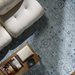 Hand-knotted Surya Almeria ALM2302 low pile area rug in multi-tone Denim, Black, Dusty Sage, and Cream.