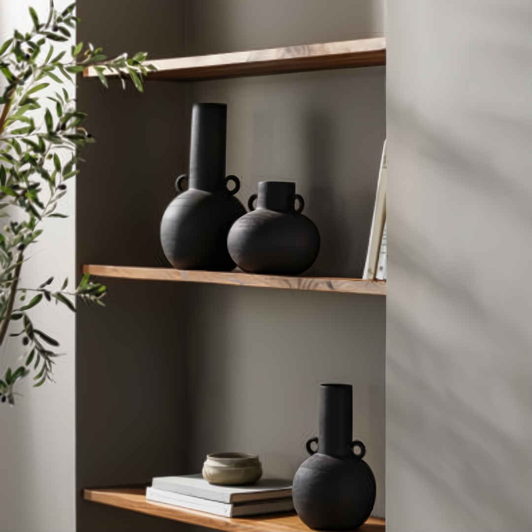 Surya Acanceh CCH-001 black ceramic decorative accent set with sculptural vase-like forms on wooden shelves.