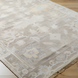 Surya Antalya AAT-2301 transitional wool area rug in beige with subtle floral patterns and fringe.