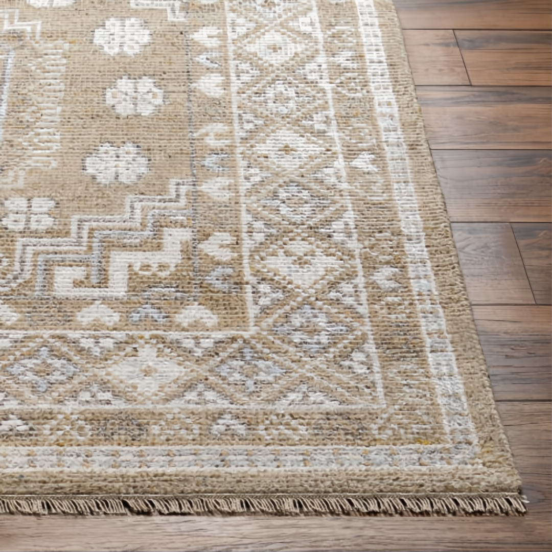 Hand-knotted Surya Almeria rug with mustard, gray, blue, beige, cream, and black geometric patterns.