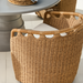Surya Marvella indoor/outdoor dining chair with woven brown Sunbrella acrylic and white cushion.
