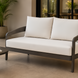 Surya Daniella outdoor loveseat with quick-dry foam cushions and a gray aluminum base.