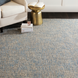 Hand-tufted Surya Aiden wool area rug in light blue and cream, with a textured medium pile.