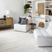 White polyester Surya Barber Accent Chair with gray rubber wood base in a modern living room.