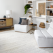 White polyester Surya Barber Accent Chair with gray rubber wood base in a modern living room.