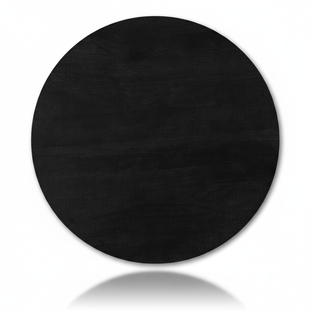 Round black Surya Agnes coffee table top, 36" wide, made from blackened mango wood.