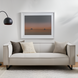 Light gray linen Surya Dylan sofa with black iron base, styled with neutral throw pillows.