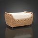 Woven rattan indoor/outdoor ottoman with a light beige cushion and curved armrests.