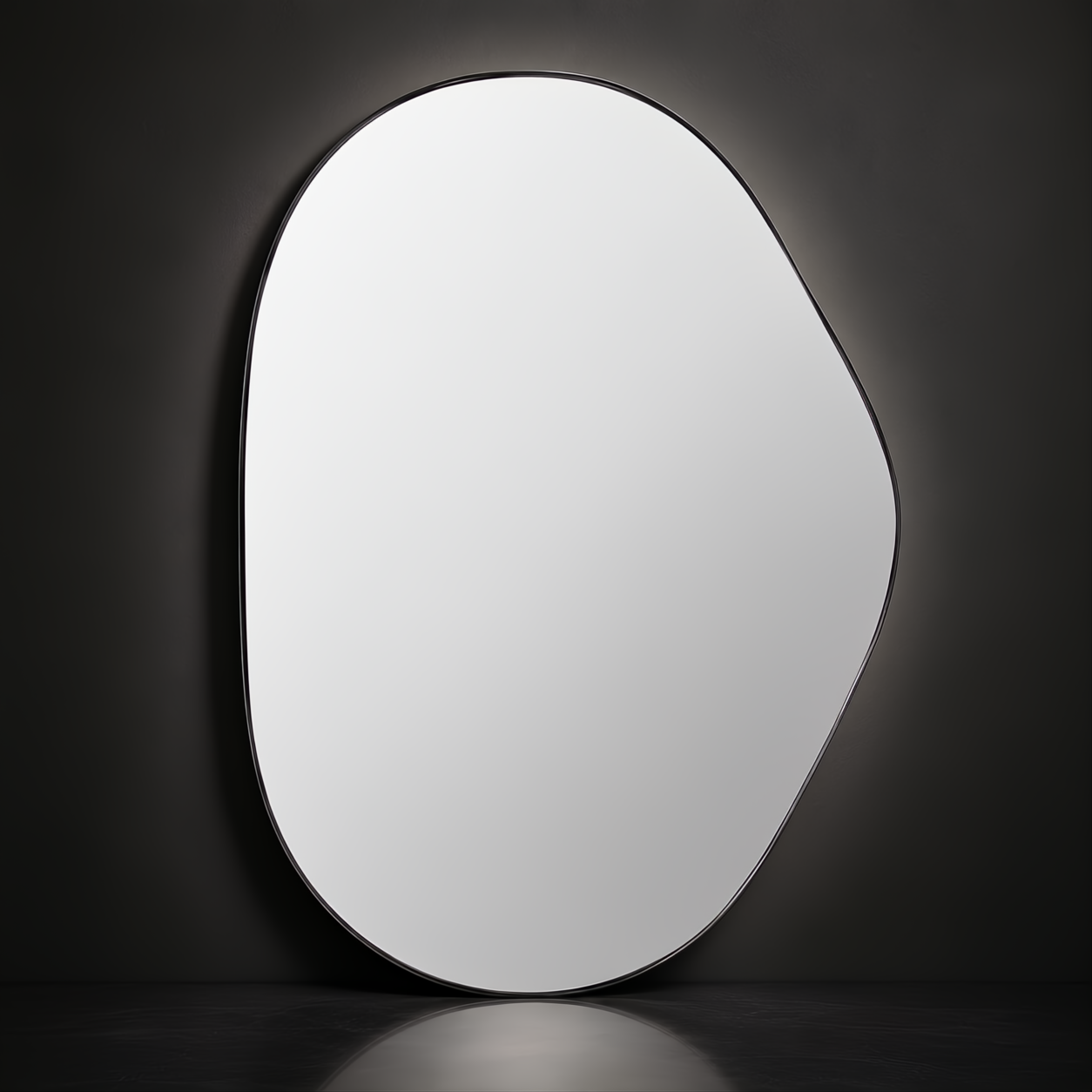Modern organic-shaped mirror with a thin black frame against a dark wall.
