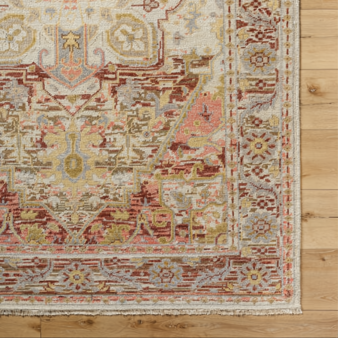 Surya Cappadocia wool rug with traditional plum, gray, burgundy, and olive pattern on light background, fringed edge.
