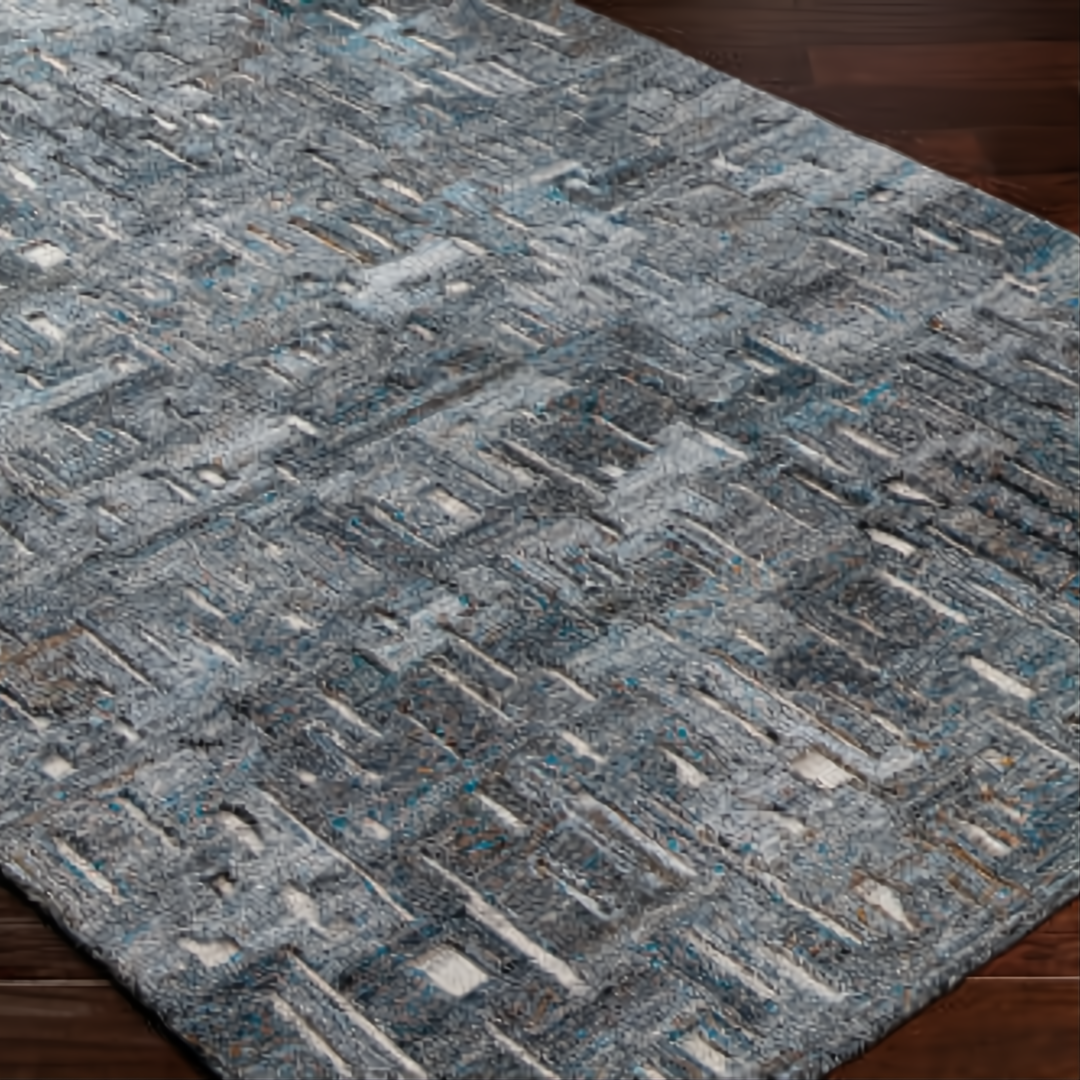 Surya Calgary CGR-2305-P hand-tufted rug with a modern geometric pattern in teal, charcoal, and light gray recycled PET yarn.