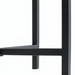 Close-up of the Surya Anaya Console Table's black powder-coated iron base, showing its slim, modern design.
