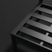 Close-up of the black powder-coated aluminum base of the Surya Antibes outdoor dining chair.