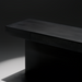Surya Coburn black brushed mango wood console table with a minimalist modern design, soft-close drawer, and plinth base.