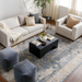 Surya Neemrana black brushed acacia wood coffee table in a modern living room.
