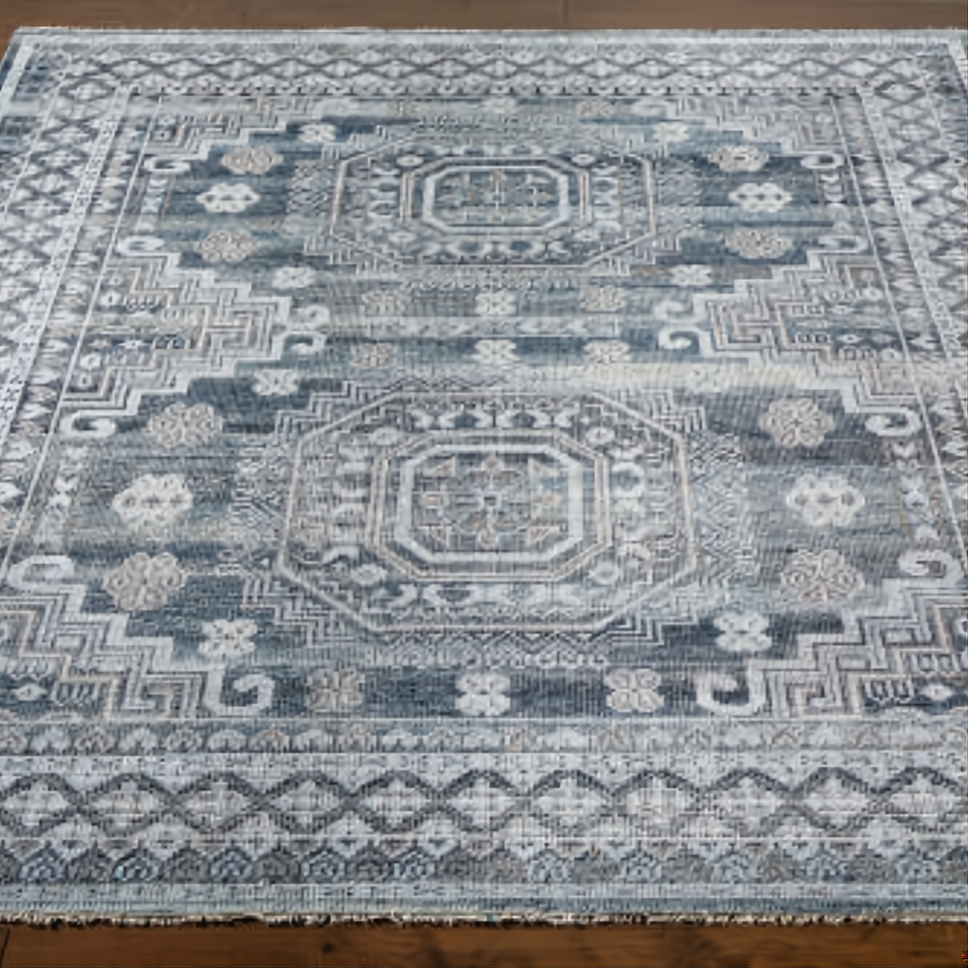 Surya Almeria low pile area rug with intricate geometric patterns in black, gray, beige, and blue.