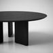 Blackened mango wood round coffee table with a beveled edge top and zigzag fluted legs.