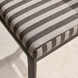 Surya Antibes dining chair with multi-color striped Sunbrella acrylic cushion and black powder-coated aluminum base.
