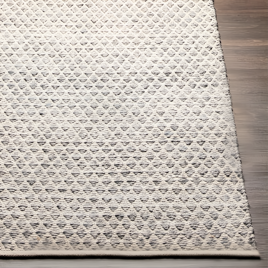 Hand-woven Surya Azalea AZA-2306 rug, light gray recycled PET yarn with subtle repeating pattern on wood floor.