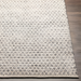 Hand-woven Surya Azalea AZA-2306 rug, light gray recycled PET yarn with subtle repeating pattern on wood floor.