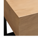 Minimalist Surya Lowmax coffee table with a light brown mango wood top and a black cast iron base.