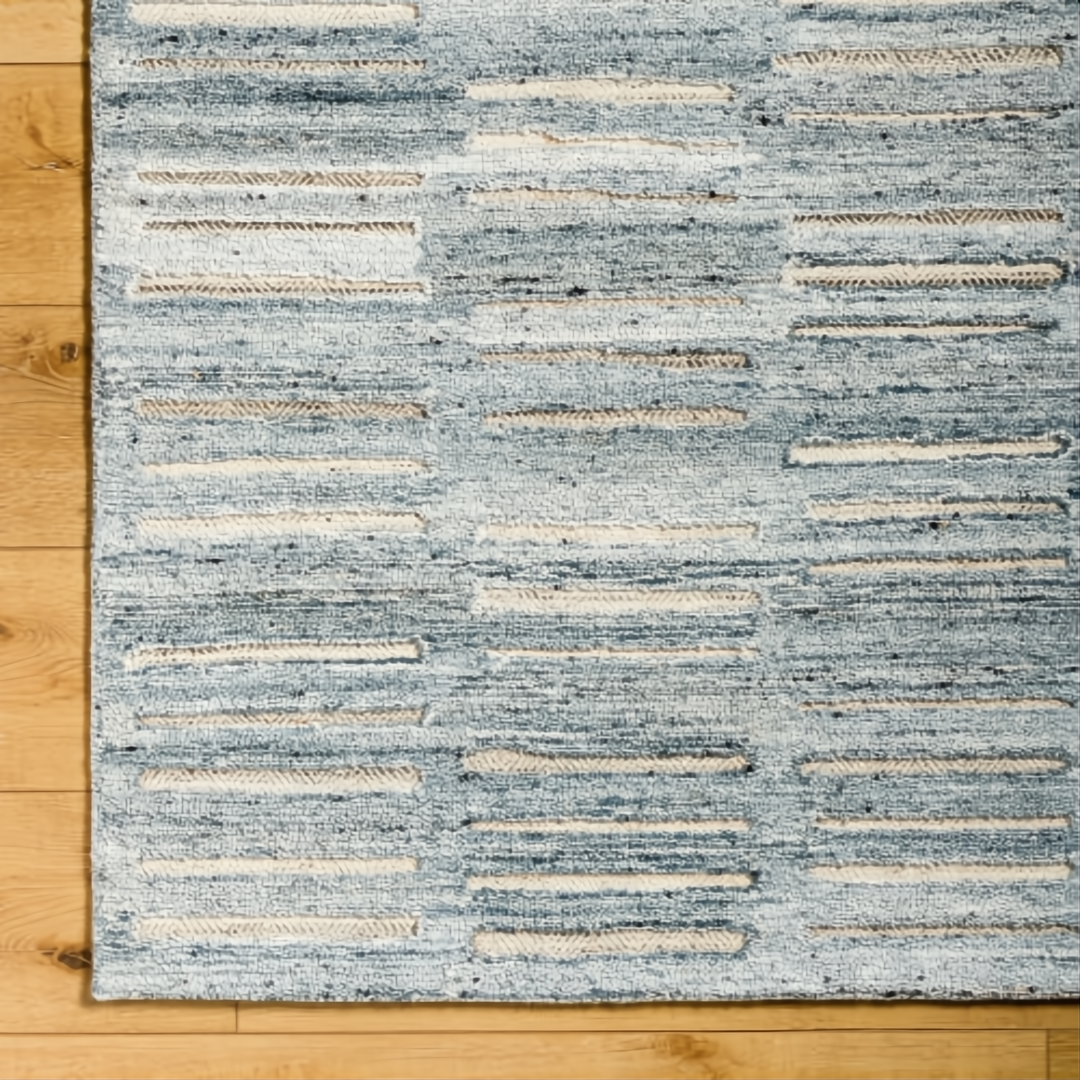 Surya Calgary CGR-2306-P hand-tufted rug with pale blue, dark blue, white, and light beige recycled PET yarn.