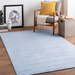 Surya Hickory HCK-2301 light slate, gray, charcoal, and cream recycled PET yarn area rug with subtle textured low pile.