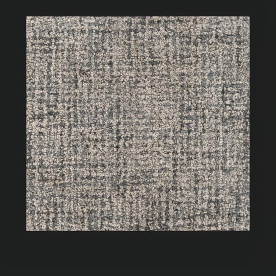 Surya Aiden wool area rug in Ink Blue and Charcoal, featuring a medium pile and hand-tufted texture.