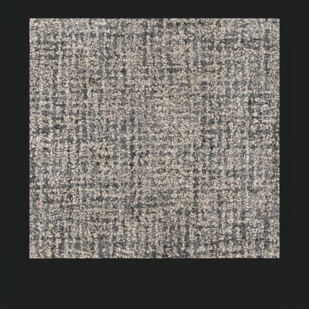 Surya Aiden wool area rug in Ink Blue and Charcoal, featuring a medium pile and hand-tufted texture.
