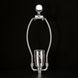 Silver metal lamp harp and socket with "SURYA" embossed, on a black background.