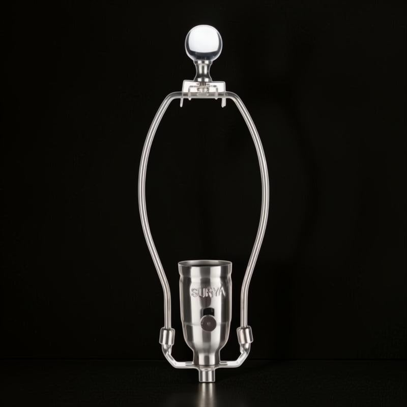 Silver metal lamp harp and socket with "SURYA" embossed, on a black background.