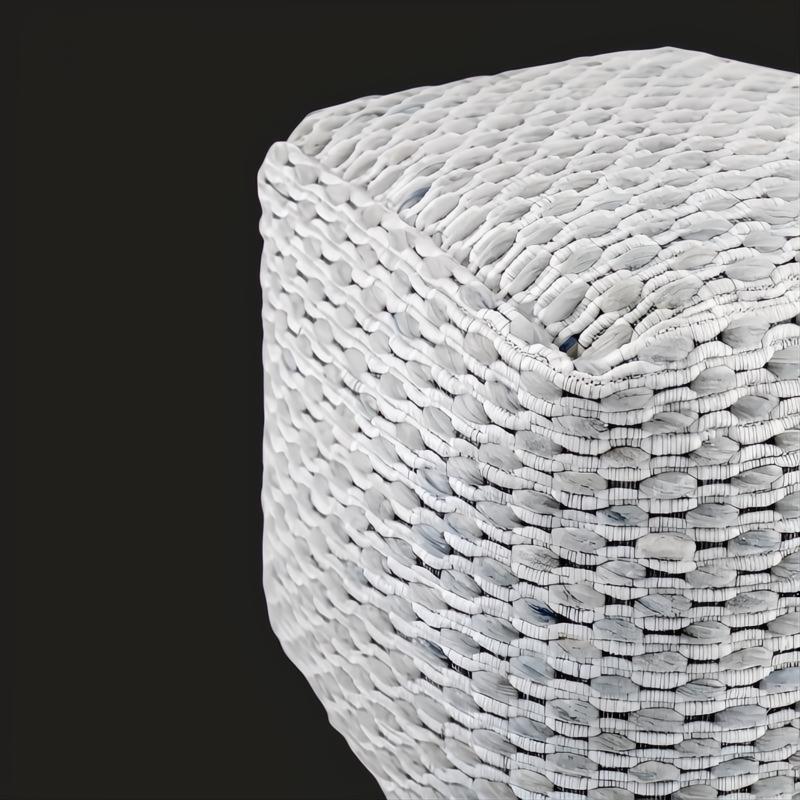 White woven wool cube pouf with stitched detailing and self-binding edge.