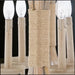 Close-up of Surya Braylee 4-light chandelier with natural wood, metal, and rope-wrapped accents.