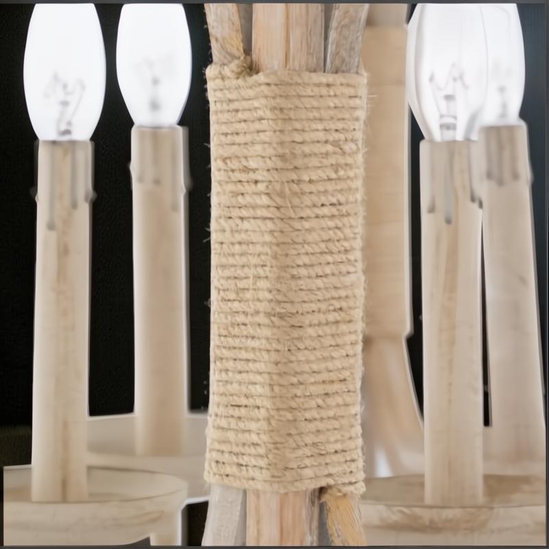 Close-up of Surya Braylee 4-light chandelier with natural wood, metal, and rope-wrapped accents.