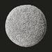 Round Surya Mohave pouf with textured light gray polyester top and soft cotton base.