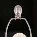 Close-up of a Surya Bentley accent table lamp's brushed metal finial and harp, showcasing its sleek, modern design.