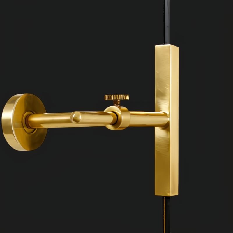 Surya Anastasya AAY-004 wall art detail: modern gold-toned metal bracket and rod against a dark background.