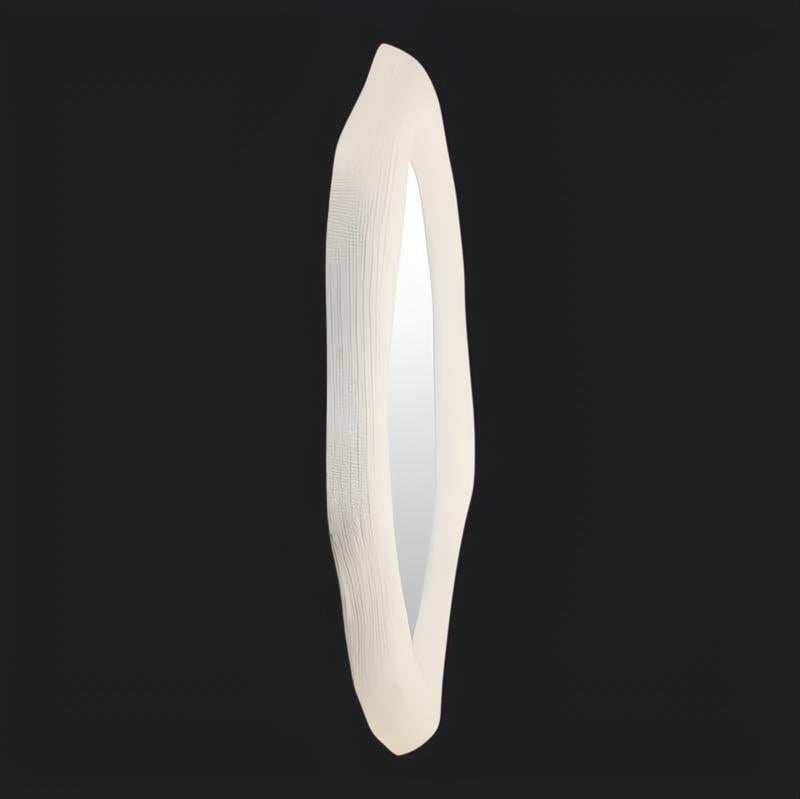 Surya Aerin AERI-001 50" H x 48" W white lacquered concrete accent mirror with a specialty shape.
