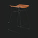 Surya Celerio counter stool with brown lacquered leather seat and gray powder-coated iron base.