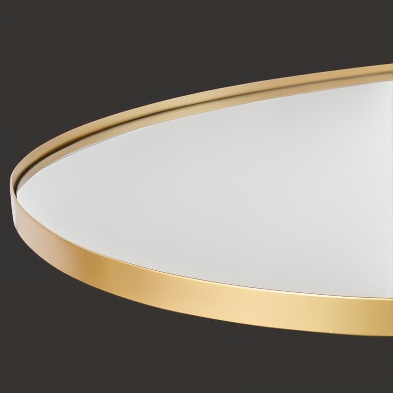 Close-up of Surya Aamnah AMH-001 wall mirror with a sleek, powder-coated gold iron frame.