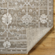 Surya Almeria low pile hand-knotted rug in light brown, medium gray, and cream with elegant fringe.