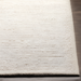 Surya Azalea AZA-2325 hand-woven, light beige recycled PET yarn area rug with a minimalist design.