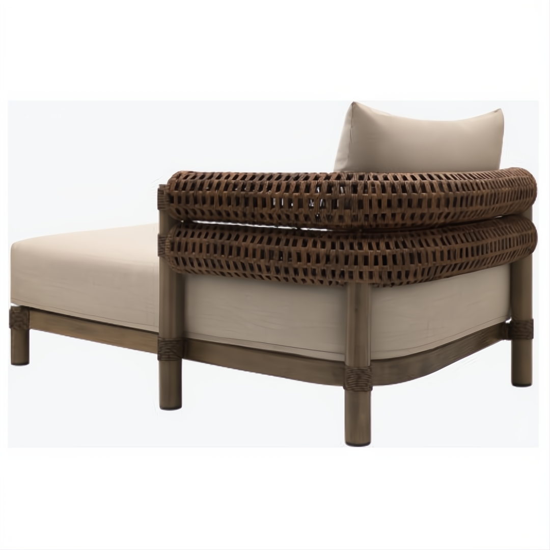 Brown Surya Porta sectional left arm chaise with beige Sunbrella cushions and woven back.