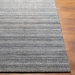 Surya Hickory HCK2303 hand-loomed rug in gray, charcoal, and cream recycled PET yarn with subtle textured stripes.