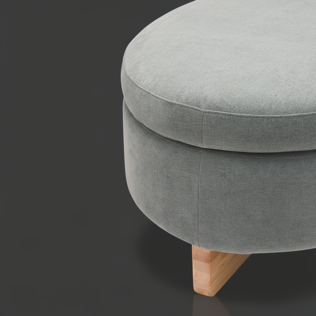 Round light green upholstered ottoman with natural wood tapered legs.