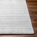 Surya Fresno FNO-2303-P light gray hand-loomed recycled PET yarn area rug with subtle striped texture.
