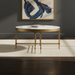 Surya Engel round coffee table with white marble top and metallic brass iron base.