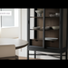 Black and brown Surya Marin Bookcase with glass doors, adjustable shelves, and displayed dishware.