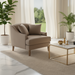 Light brown upholstered Surya Maywood accent chair with two pillows, dark wood legs, and a modern design.
