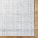 Surya Hope HOP-2303-P hand-loomed flatwoven rug in white, gray, and light slate recycled PET yarn.